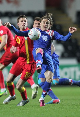 260313 - Wales v Croatia, World Cup Qualifier, Swansea - Croatia's Luka Modric and Wales' Andy King compete for the ball