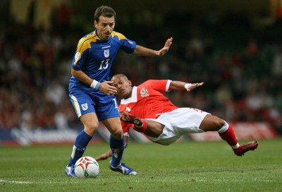 11.10.06...Wales v Cyprus, Euro 2008 Qualifying, Cardiff. Wales'  Robert Earnshaw is unended by Konstantinos Makridis 