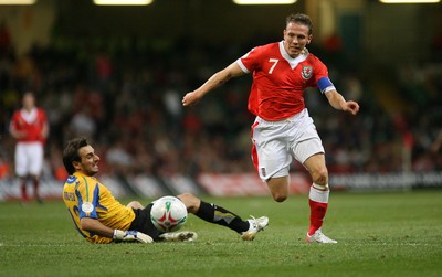 11.10.06...Wales v Cyprus, Euro 2008 Qualifying, Cardiff. Wales' Craig Bellamy breaks past keeper Michalis Morphis 