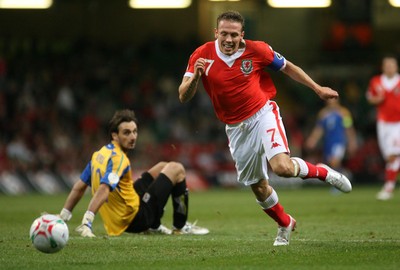 11.10.06...Wales v Cyprus, Euro 2008 Qualifying, Cardiff. Wales' Craig Bellamy breaks past keeper Michalis Morphis 
