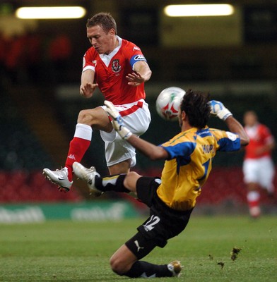 11.10.06 - Euro 2008 Qualifying Match, Group D Wales v Cyprus Wales' Craig Bellamy is brought down by a Michael Morphis challenge 