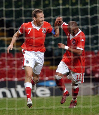 11.10.06 - Euro 2008 Qualifying Match, Group D Wales v Cyprus Wales' Craig Bellamy celebrates scoring his sides third goal with Rob Earnshaw 