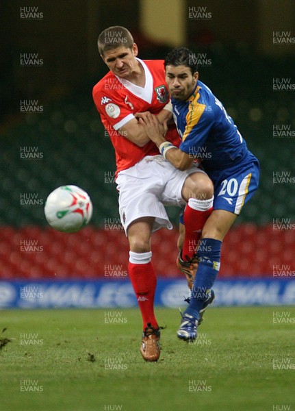 11.10.06...Wales v Cyprus, Euro 2008 Qualifying, Cardiff. Wales' Carl Robinson collides with Konstantinos Makridis 