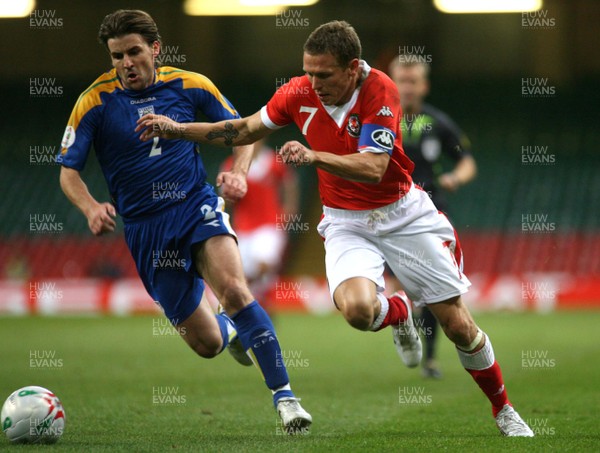 11.10.06...Wales v Cyprus, Euro 2008 Qualifying, Cardiff. Wales'  Craig Bellamy takes on Georgios Theodotou 