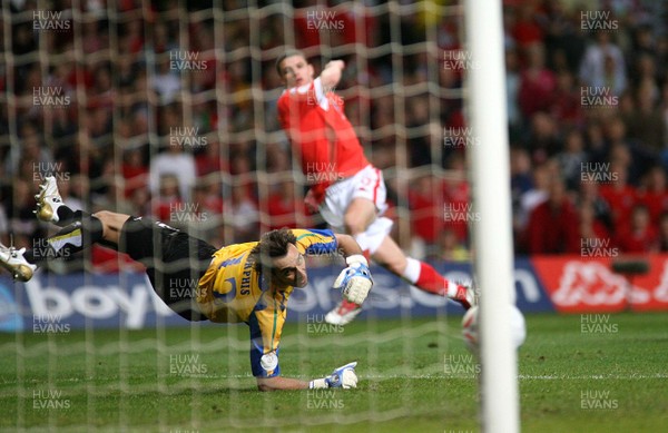 11.10.06...Wales v Cyprus, Euro 2008 Qualifying, Cardiff. Wales'  Jason Koumas and Cyprus keeper Michalis Morphis watch as his shot shaves the Cyprus goalposts 
