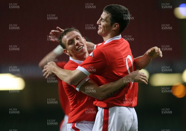 11.10.06...Wales v Cyprus, Euro 2008 Qualifying, Cardiff. Wales' Jason Koumas celebrates his goal with Craig Bellamy 