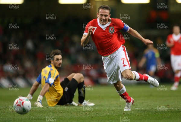 11.10.06...Wales v Cyprus, Euro 2008 Qualifying, Cardiff. Wales' Craig Bellamy breaks past keeper Michalis Morphis 