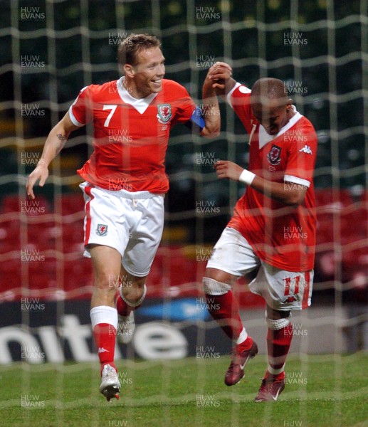 11.10.06 - Euro 2008 Qualifying Match, Group D Wales v Cyprus Wales' Craig Bellamy celebrates scoring his sides third goal with Rob Earnshaw 