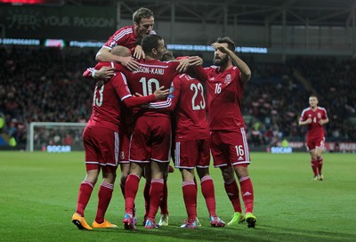 131014 - Wales v Cyprus - UEFA European Championship - Hal Robson-Kanu of Wales celebrates scoring their second goal with team mates