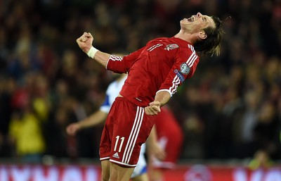 131014 - Wales v Cyprus - UEFA European Championship - Gareth Bale of Wales roars at full time as they win 2-1