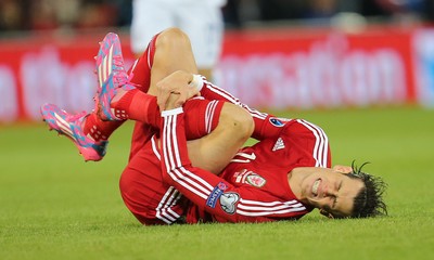131014 - Wales v Cyprus, UEFA European Championship Qualifier - Wales' Gareth Bale is brought down by Marios Nikolaou of Cyprus