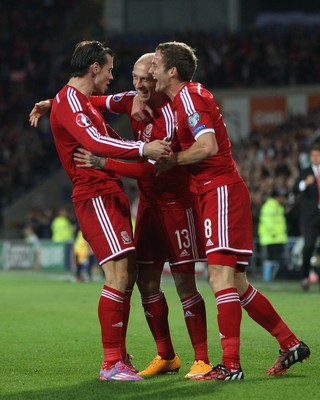 131014 - Wales v Cyprus, UEFA European Championship Qualifier - Wales' David Cotterrill celebrates with Gareth Bales and Andy King after scoring goal