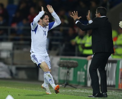 131014 - Wales v Cyprus, UEFA European Championship Qualifier - Vincent Laban of Cyprus celebrates with Cyprus manager Charalampos Christodoulou after scoring goal