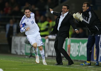 131014 - Wales v Cyprus, UEFA European Championship Qualifier - Vincent Laban of Cyprus celebrates with Cyprus manager Charalampos Christodoulou after scoring goal