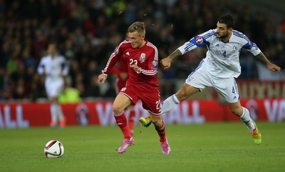 131014 - Wales v Cyprus, UEFA European Championship Qualifier - Wales' George Williams is challenged by Giorgos Merkis of Cyprus