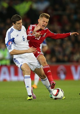 131014 - Wales v Cyprus, UEFA European Championship Qualifier - Wales' George Williams is challenged by Angelis Angelis of Cyprus