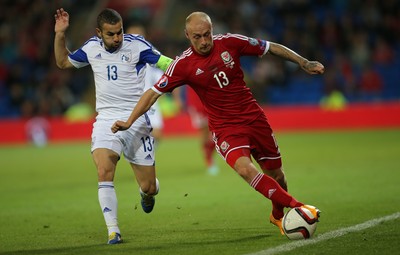 131014 - Wales v Cyprus, UEFA European Championship Qualifier - Wales' David Cotterrill takes on Constantinos Makridis of Cyprus