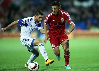 131014 - Wales v Cyprus, UEFA European Championship Qualifier - Wales' Neil Taylor gets past George Efrem of Cyprus
