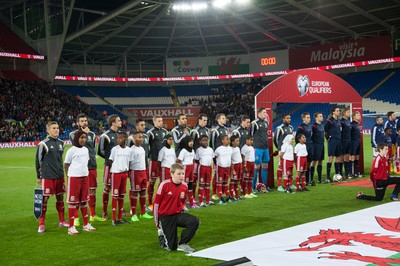 131014 - Wales v Cyprus, UEFA European Championship Qualifier - The teams line up for the national anthems