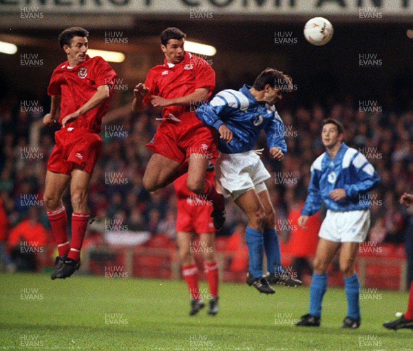 131093 - Wales v Cyprus - FIFA World Cup Qualifier - Ian Rush and Gary Speed jump to get to the ball