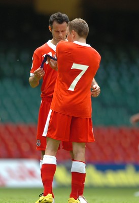 02.06.07 - Wales v Czech Republic - UEFA Euro 2008 Qualifying, Group D - Wales' Ryan Giggs passes on his captains armband to Craig Bellamy(no. 7) 