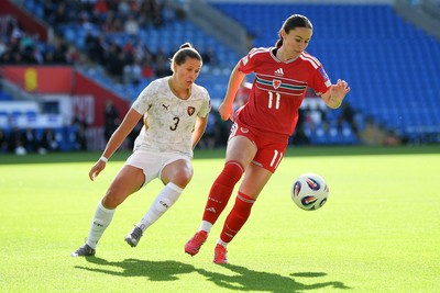 090626 - Wales Women v Czech Republic Women - 2027 FIFA Women's World Cup Qualifying - Hannah Cain of Wales is challenged by Eliska Sonntagova of Czech Republic