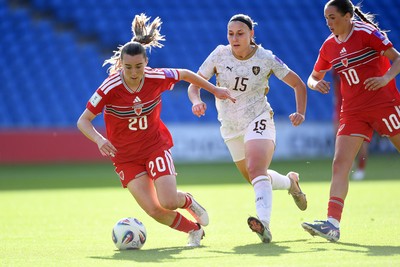 090626 - Wales Women v Czech Republic Women - 2027 FIFA Women's World Cup Qualifying - Carrie Jones of Wales is challenged by Katerina Kotrcova of Czech Republic