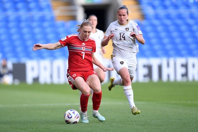 090626 - Wales Women v Czech Republic Women - 2027 FIFA Women's World Cup Qualifying - Ceri Holland of Wales is challenged by Michaela Khyrova of Czech Republic