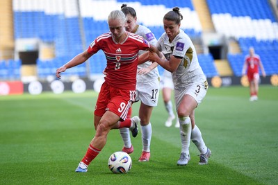 090626 - Wales Women v Czech Republic Women - 2027 FIFA Women's World Cup Qualifying - Elise Hughes of Wales is challenged by Eliska Sonntagova of Czech Republic