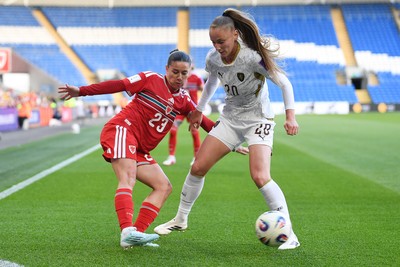 090626 - Wales Women v Czech Republic Women - 2027 FIFA Women's World Cup Qualifying - Ffion Morgan of Wales is challenged by Sabina Strizova of Czech Republic