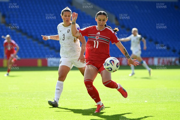 090626 - Wales Women v Czech Republic Women - 2027 FIFA Women's World Cup Qualifying - Hannah Cain of Wales is challenged by Eliska Sonntagova of Czech Republic