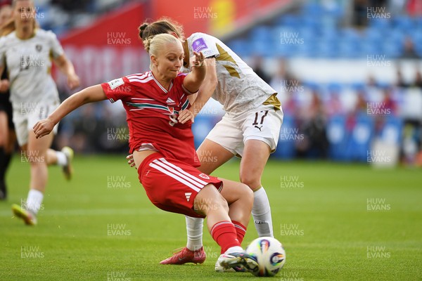 090626 - Wales Women v Czech Republic Women - 2027 FIFA Women's World Cup Qualifying - Elise Hughes of Wales is pulled back by Barbora Polcarova of Czech Republic as she takes a shot