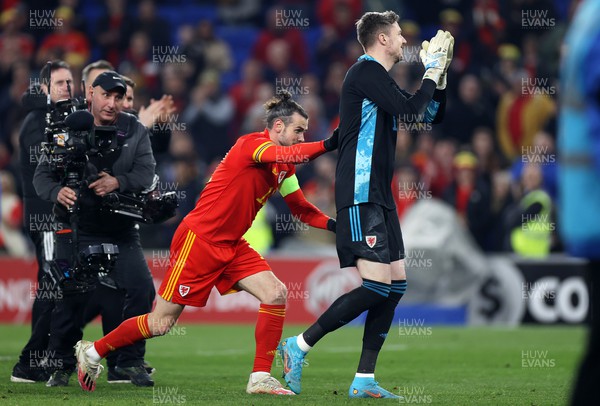 290322 - Wales v Czech Republic - International Friendly - Gareth Bale pushes Wayne Hennessey of Wales towards the Canton Stand on his 100th cap