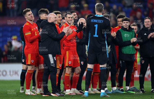 290322 - Wales v Czech Republic - International Friendly - Rob Page and Gareth Bale along with team mates applaud Wayne Hennessey of Wales on his 100th cap