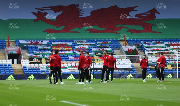 300321 Wales v Czech Republic, FIFA World Cup 2022 Qualifying match - Wales players chat on the pitch ahead of warm up after arriving at the Cardiff City Stadium
