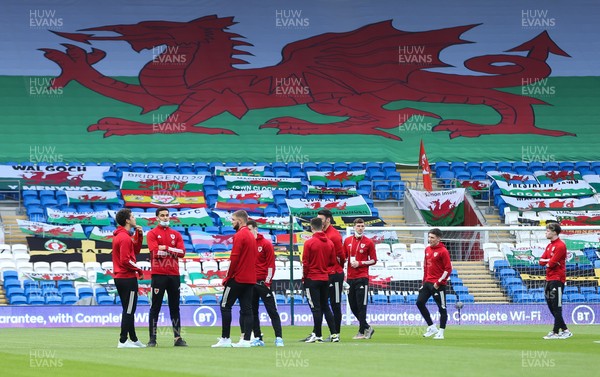 300321 Wales v Czech Republic, FIFA World Cup 2022 Qualifying match - Wales players chat on the pitch ahead of warm up after arriving at the Cardiff City Stadium