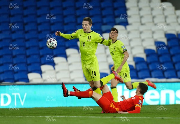 300321 Wales v Czech Republic, FIFA World Cup 2022 Qualifying match - Jakub Jankto of Czech Republic is tackled by Chris Mepham of Wales