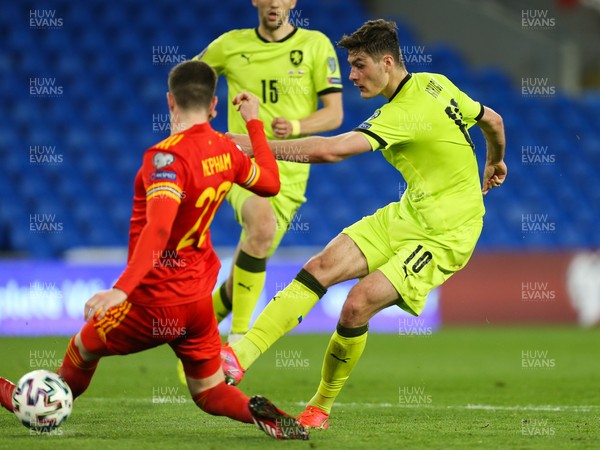 300321 Wales v Czech Republic, FIFA World Cup 2022 Qualifying match - Patrik Schick of Czech Republic sees his shot blocked by Chris Mepham of Wales