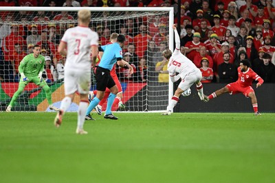 041026 - Wales v Denmark - UEFA Nations League - Rasmus Hojlund of Denmark has a shot blocked by Jay Dasilva of Wales