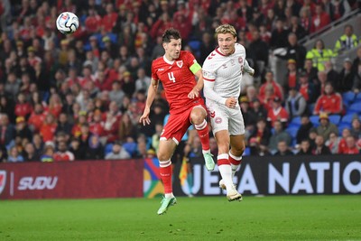 041026 - Wales v Denmark - UEFA Nations League - Ben Davies of Wales is challenged by Rasmus Hojlund of Denmark
