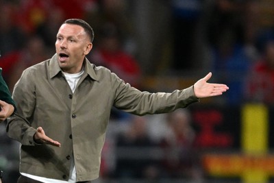 041026 - Wales v Denmark - UEFA Nations League - Craig Bellamy, Wales Manager debates  with Denmark assistant coaches 