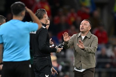 041026 - Wales v Denmark - UEFA Nations League - Craig Bellamy, Wales Manager debates  with Denmark assistant coaches 