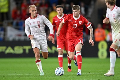041026 - Wales v Denmark - UEFA Nations League -  Jordan James of Wales is challenged by Gustav Isaksen of Denmark