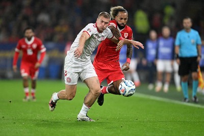 041026 - Wales v Denmark - UEFA Nations League - Sorba Thomas of Wales is challenged by Rasmus Kristensen of Denmark