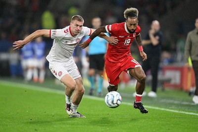 041026 - Wales v Denmark - UEFA Nations League - Sorba Thomas of Wales is challenged by Rasmus Kristensen of Denmark