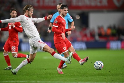 041026 - Wales v Denmark - UEFA Nations League - Liam Cullen of Wales is challenged by Morten Hjulmand of Denmark