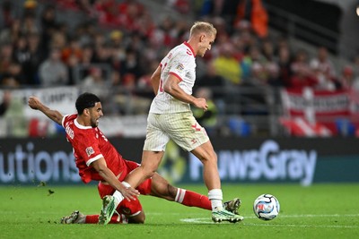041026 - Wales v Denmark - UEFA Nations League - Ben Cabango of Wales is challenged by Oliver Provstgaard of Denmark