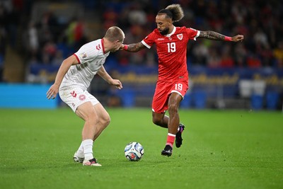 041026 - Wales v Denmark - UEFA Nations League - Sorba Thomas of Wales is challenged by Rasmus Kristensen of Denmark