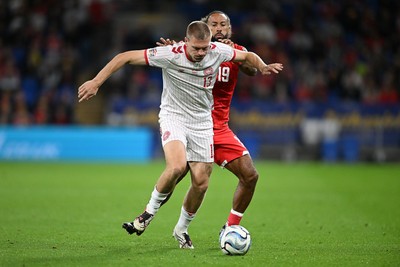 041026 - Wales v Denmark - UEFA Nations League - Sorba Thomas of Wales is challenged by Rasmus Kristensen of Denmark