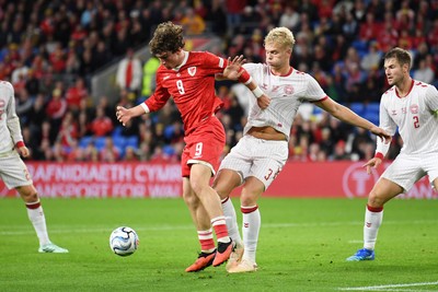 041026 - Wales v Denmark - UEFA Nations League - Lewis Koumas of Wales is challenged by Oliver Provstgaard of Denmark